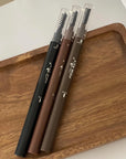 Eyebrow pencil with brush